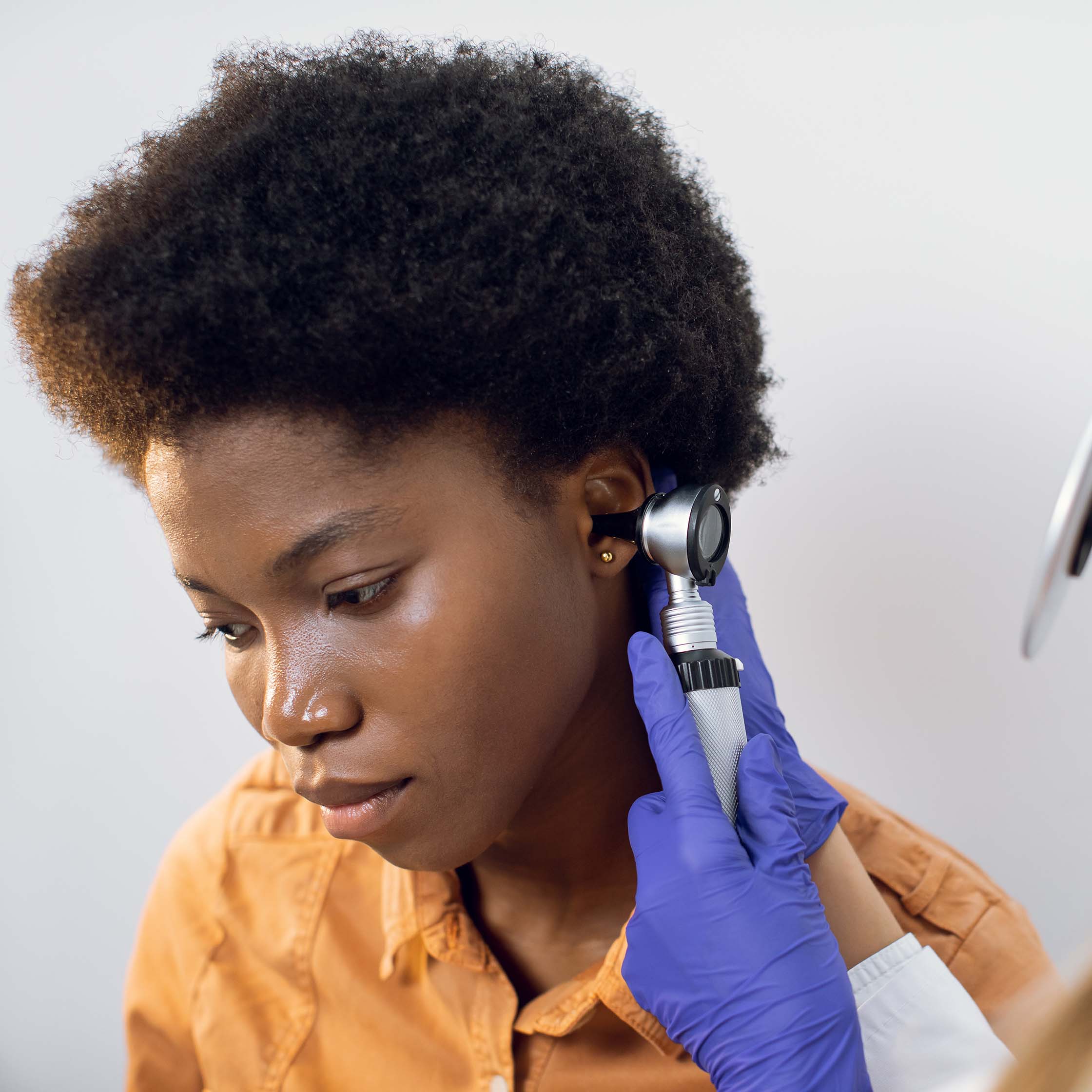 Patient receiving a hearing and ear examination at SPRING ENT